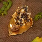 Brass Shree Ganesh Diya with Leaf Base – Metal Ganpati Idol for Pooja, Vastu, and Gifting (9.5x10.5x6 cm)