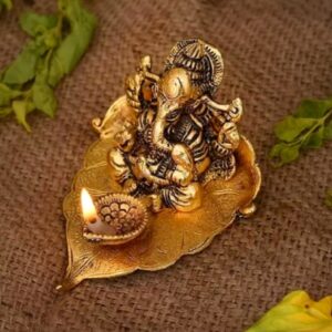 Brass Shree Ganesh Diya with Leaf Base – Metal Ganpati Idol for Pooja, Vastu, and Gifting (9.5x10.5x6 cm)